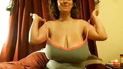 Amateur posing her gigantic tits in the webcam