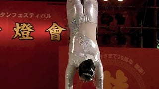 GORGEOUS CHINESE GIRL PERFORMING DEATH DEFYING STUNT